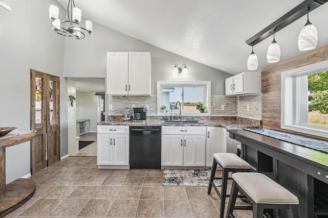 kitchen with dishwasher, white cabinetry, and sink