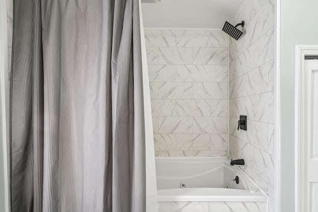 bathroom with shower / bath combination with curtain