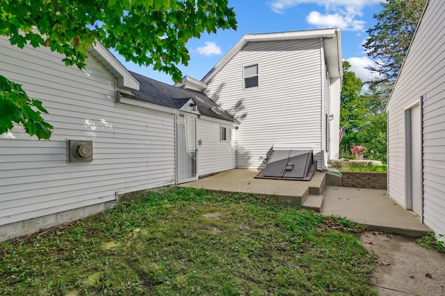 back of property featuring a patio area