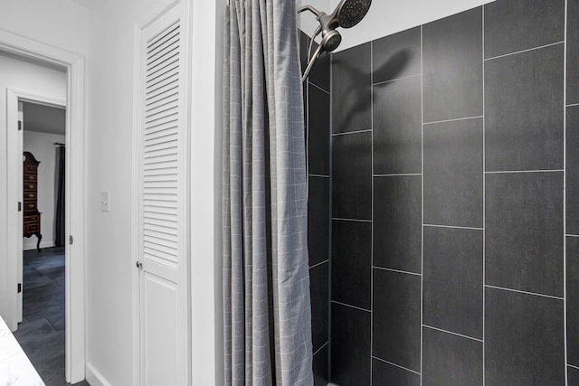 bathroom with a shower with shower curtain