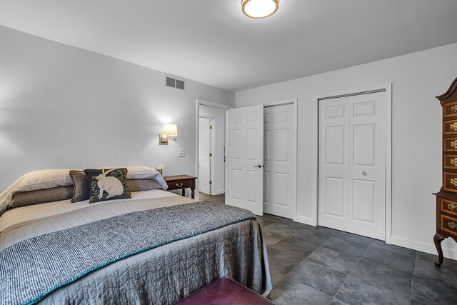 bedroom featuring two closets