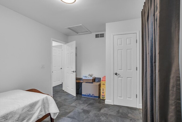 125 Westshore Dr, Jerome, MI 49249 - bedroom featuring visible vents, baseboards, and attic access