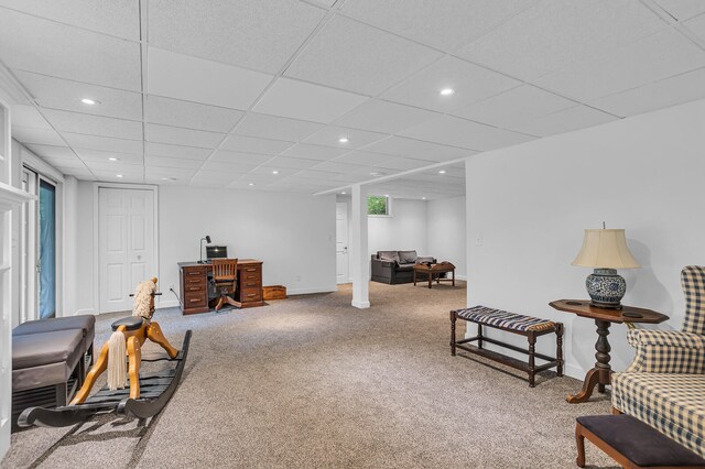 sitting room featuring a paneled ceiling and carpet flooring