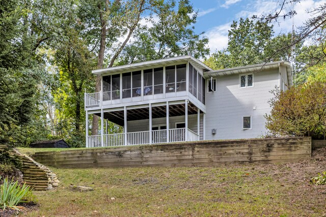 back of house with a sunroom