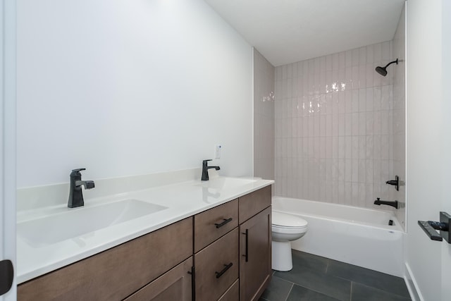 full bathroom featuring tile patterned flooring, vanity, toilet, and tiled shower / bath