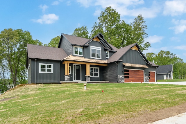 craftsman-style home with a front yard and covered porch