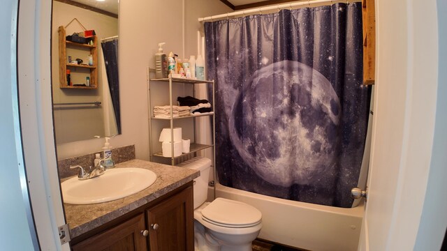 full bathroom featuring shower / tub combo, vanity, and toilet