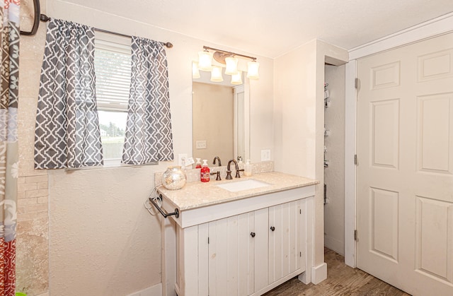 bathroom featuring vanity and hardwood / wood-style flooring