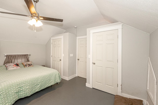 bedroom with vaulted ceiling, ceiling fan, and a textured ceiling