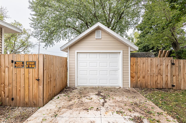 garage featuring wooden walls