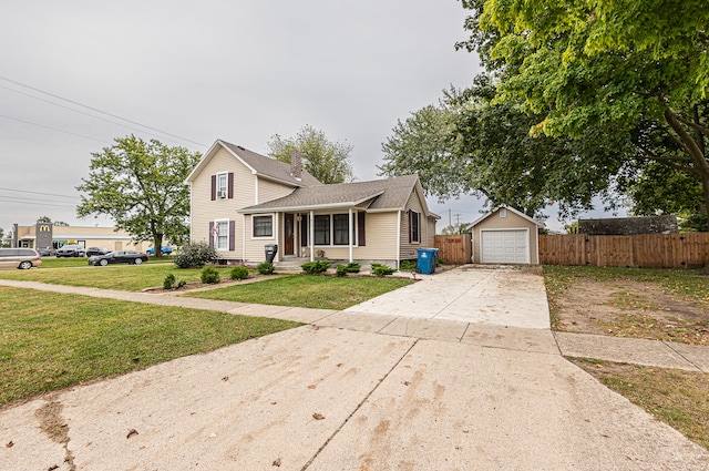 view of front of home with a front yard and a garage