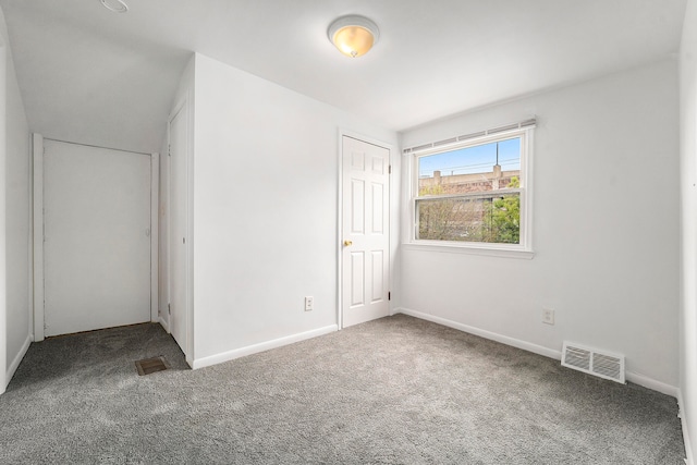 unfurnished bedroom with a closet and carpet