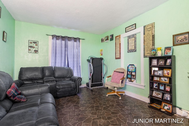 living room with a textured ceiling