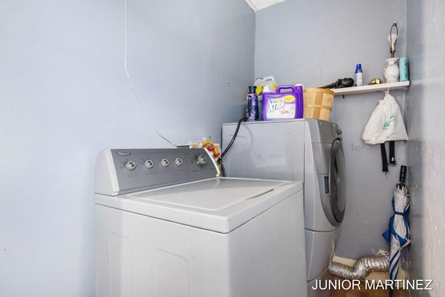 washroom featuring washing machine and dryer