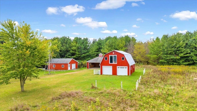 view of yard featuring an outbuilding and a garage