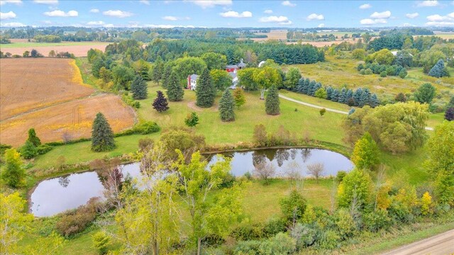 bird's eye view featuring a water view and a rural view