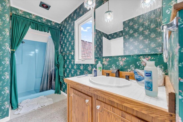 bathroom with vanity and curtained shower