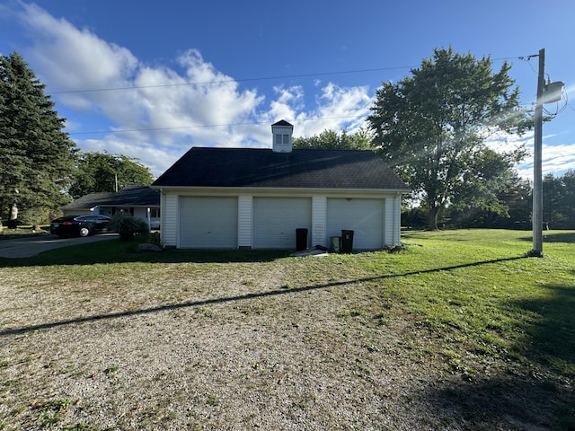 garage with a lawn