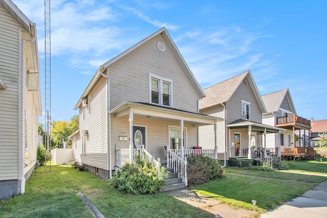 view of front of property with a porch and a front lawn