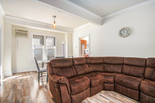 living room with ornamental molding, light wood-type flooring, and a wall mounted air conditioner