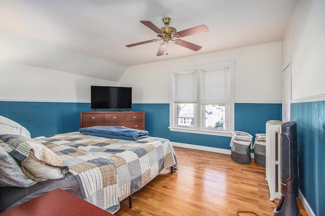 bedroom featuring lofted ceiling, ceiling fan, and hardwood / wood-style floors