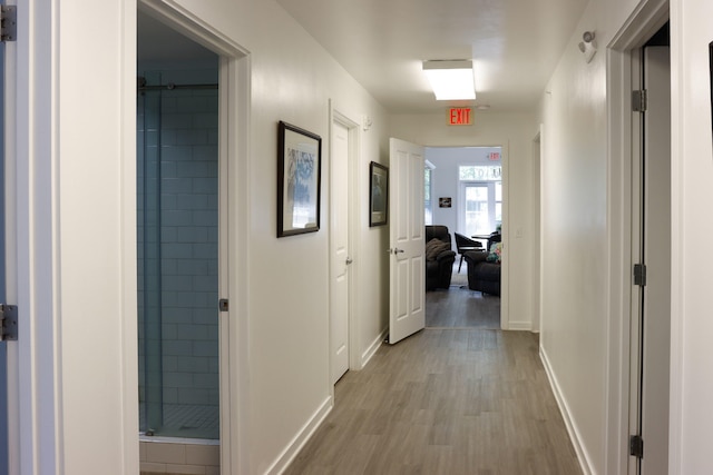 hall with light wood-type flooring