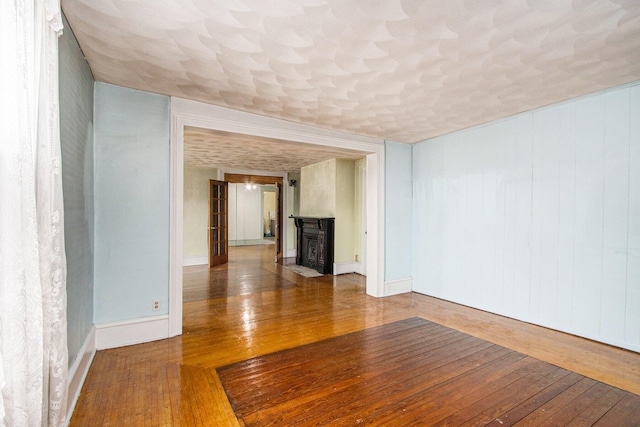 unfurnished living room featuring hardwood / wood-style floors