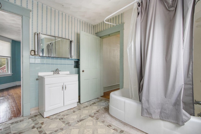 bathroom with vanity and shower / bath combo