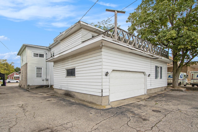 view of property exterior with a garage