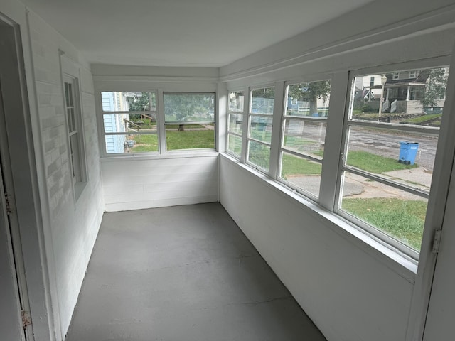 unfurnished sunroom featuring plenty of natural light