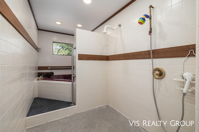 bathroom featuring tile walls, tile patterned floors, and tiled shower