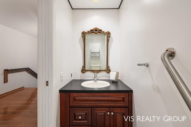 bathroom featuring vanity and hardwood / wood-style flooring