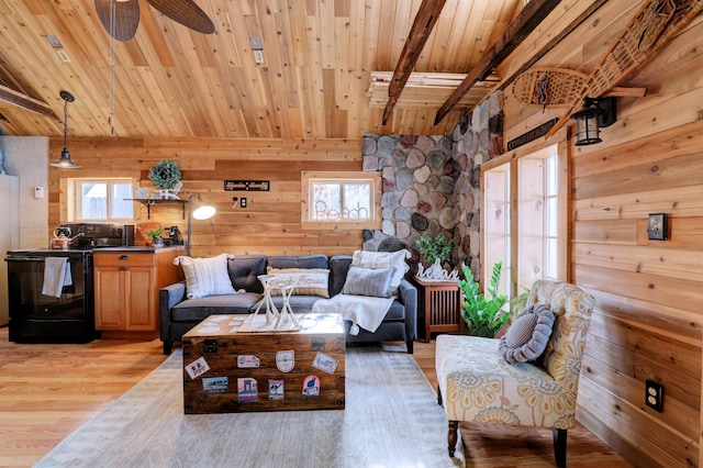 living room featuring plenty of natural light, wood ceiling, and light hardwood / wood-style floors