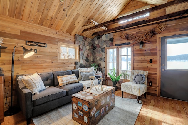 living room featuring wood walls, lofted ceiling, hardwood / wood-style floors, and wooden ceiling