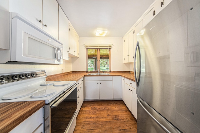 kitchen featuring white cabinetry, white appliances, dark hardwood / wood-style floors, sink, and wood counters