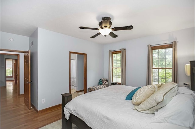 bedroom featuring hardwood / wood-style floors and ceiling fan