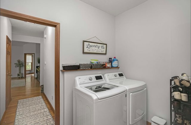 washroom featuring light hardwood / wood-style floors and independent washer and dryer