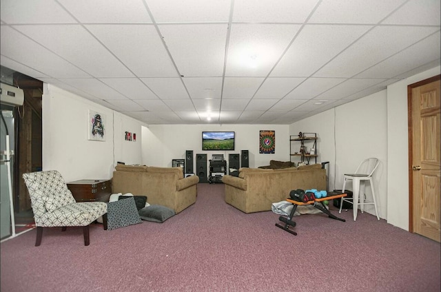 carpeted living room with a drop ceiling