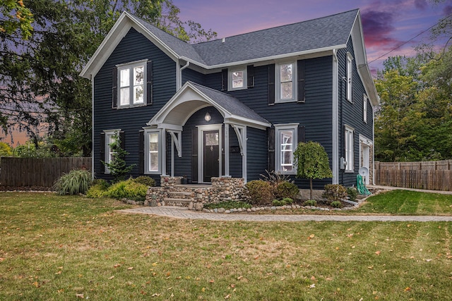 view of front of home with a lawn