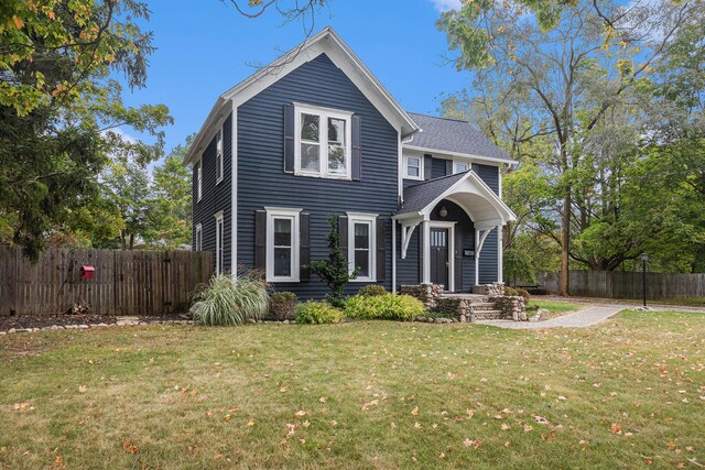 view of front of property with a front lawn