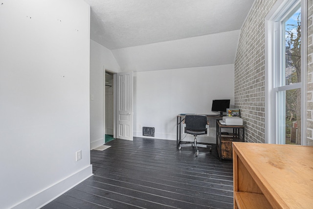 office with a textured ceiling, lofted ceiling, and dark hardwood / wood-style floors