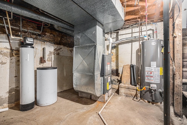 utility room featuring gas water heater and heating unit