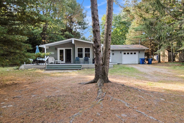 view of front of home with an outdoor structure and a garage