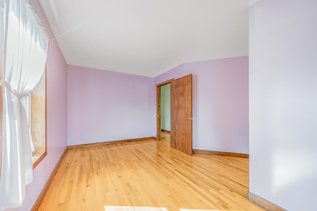 spare room with light hardwood / wood-style flooring