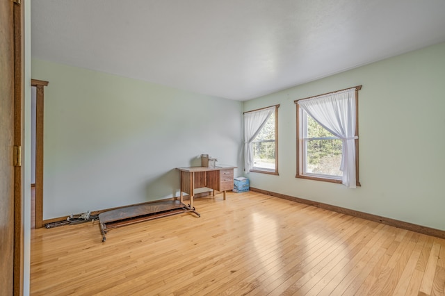 spare room with light hardwood / wood-style floors