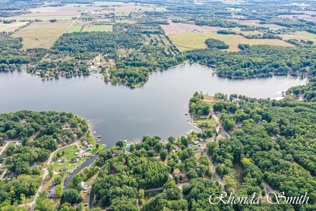 birds eye view of property with a water view