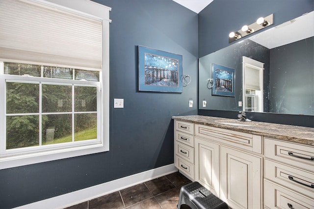 bathroom with tile patterned flooring and vanity