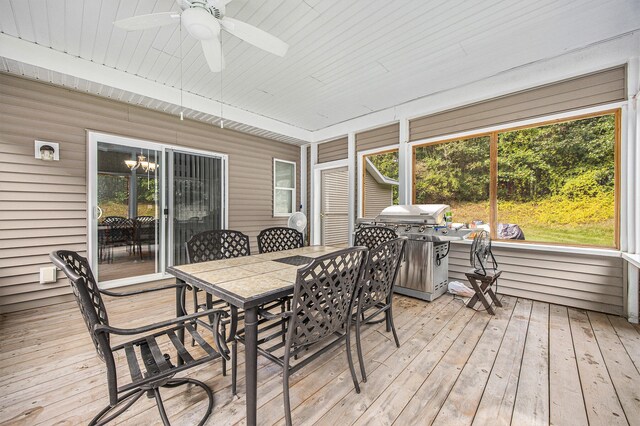 sunroom / solarium featuring wooden ceiling and ceiling fan