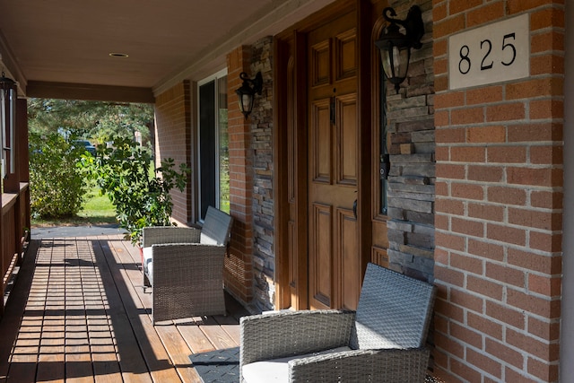 wooden terrace featuring a porch