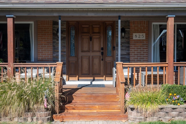 property entrance with covered porch